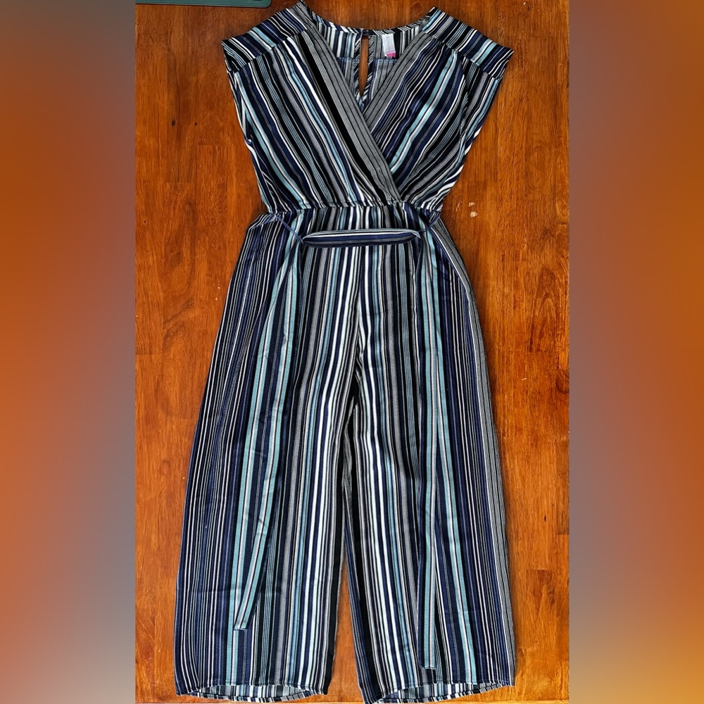 ‘No Boundaries’ multicolored jumpsuit with tie/wraparound.